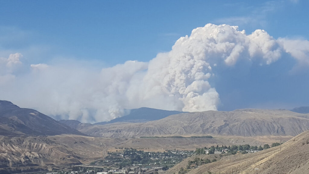 Smoke rising from a fire at Elephant Hill overlooking Kamloops.