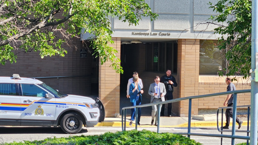 Individuals can be seen exiting the Kamloops Law Courts on June 19, 2025 due to an "unfolding incident."